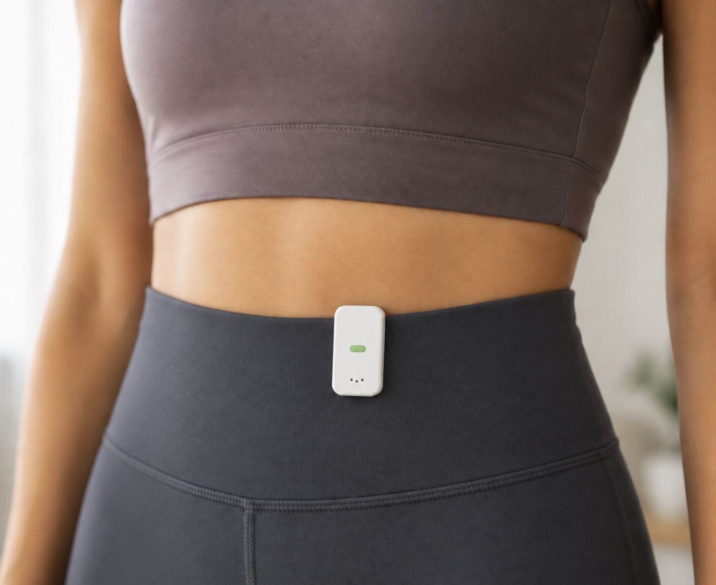 MoKlip clipped to a waistband for an abdomen measurement