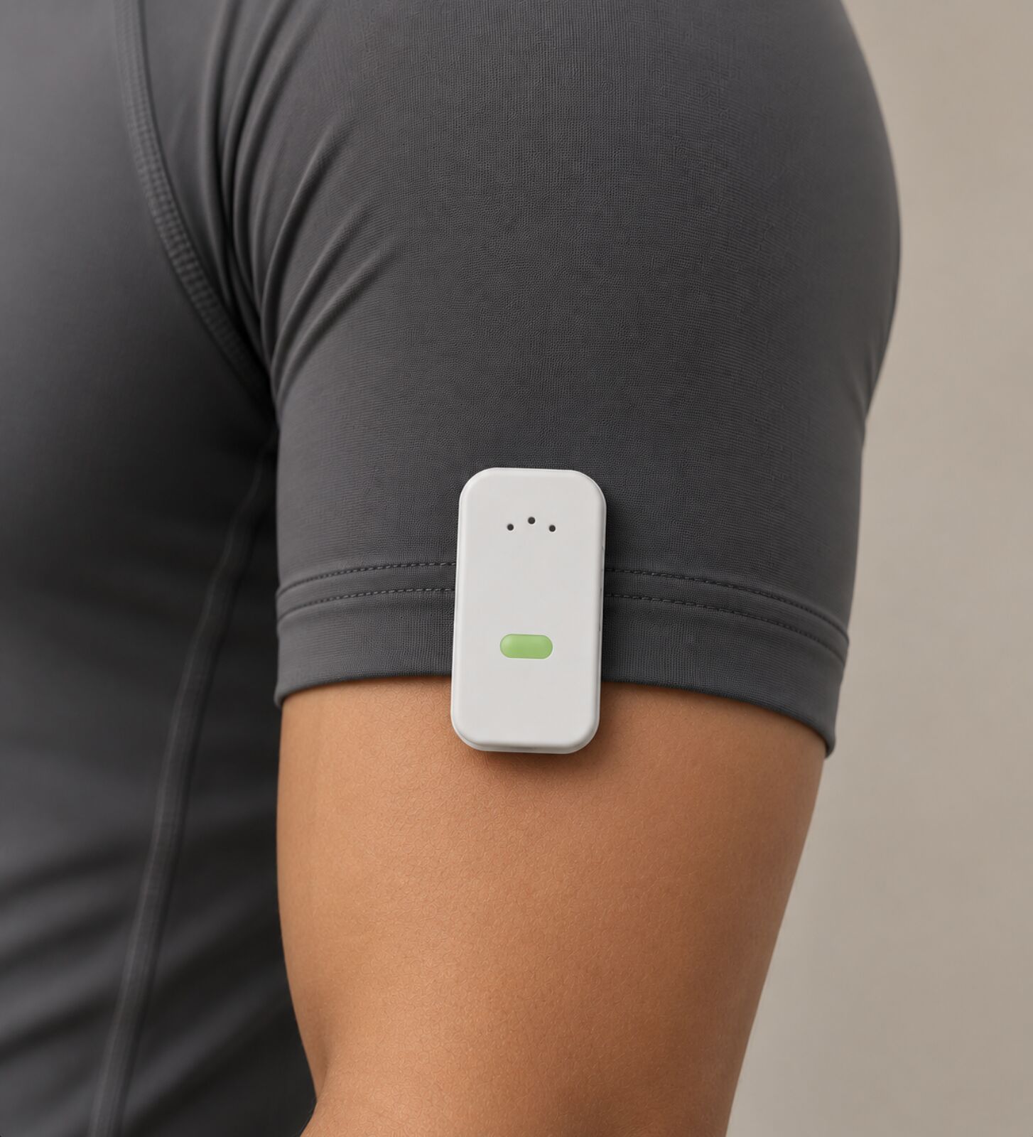 MoKlip clipped to a sleeve for an upper-arm measurement